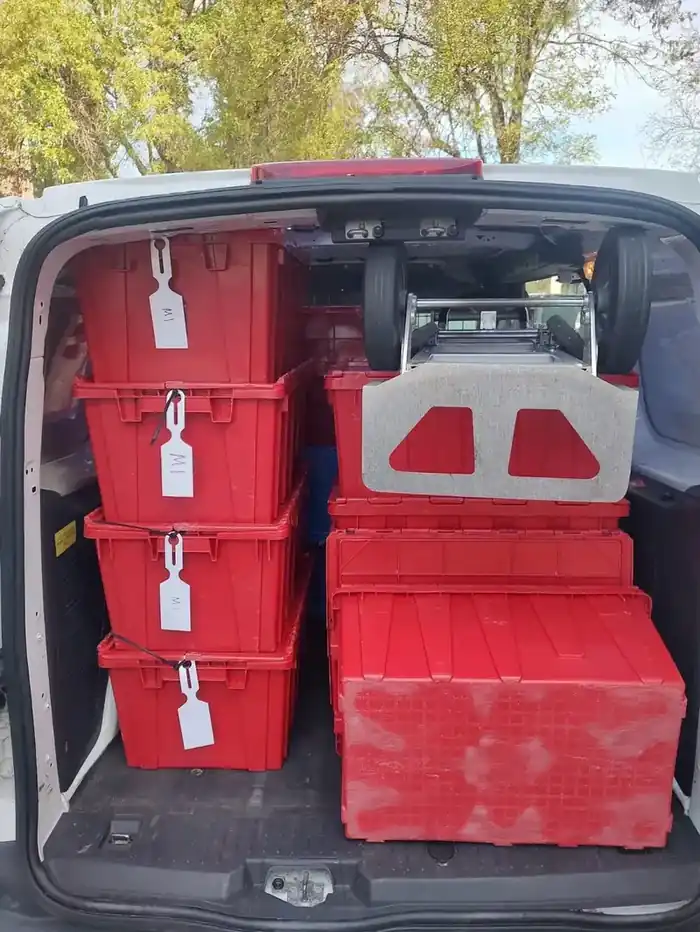Crates securely loaded in Santini delivery vehicle
